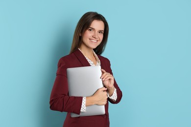 Banker with laptop on light blue background