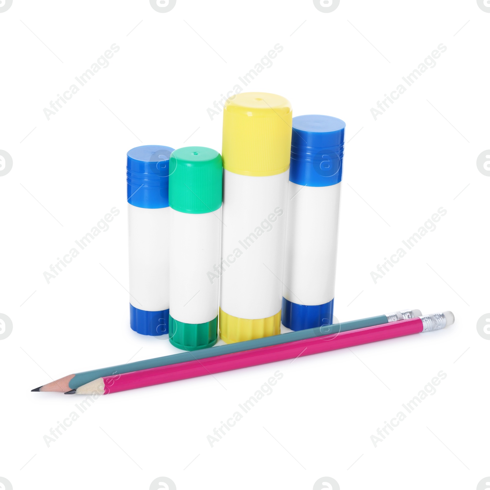 Photo of Glue sticks and pencils isolated on white