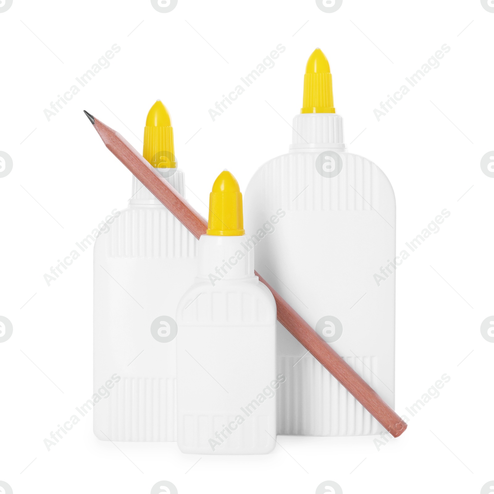 Photo of Bottles of glue and pencil isolated on white