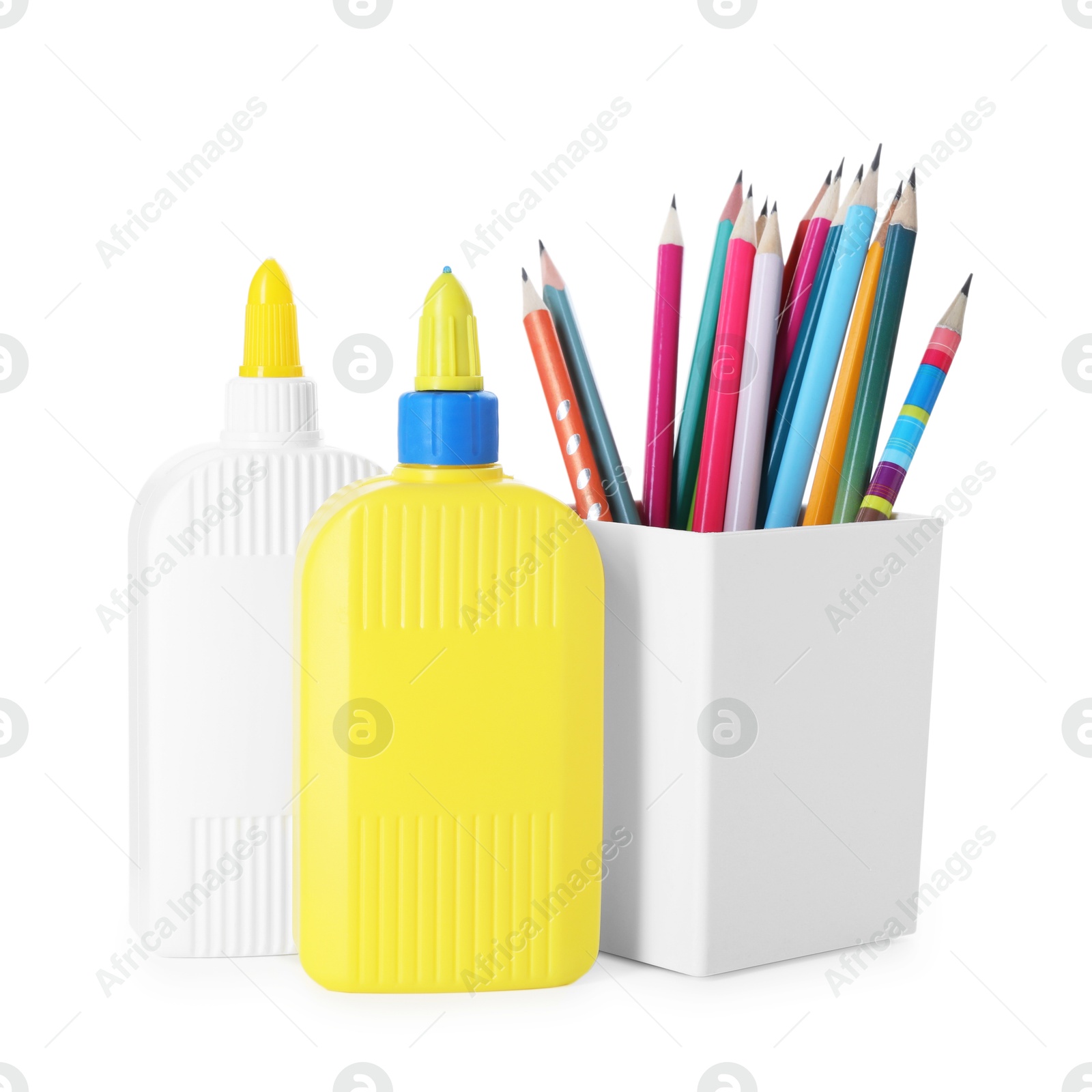 Photo of Bottles of glue and pencils isolated on white