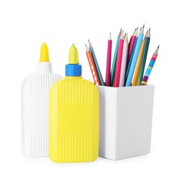 Photo of Bottles of glue and pencils isolated on white