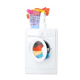 Photo of Washing machine, detergent and laundry basket with colorful clothes isolated on white