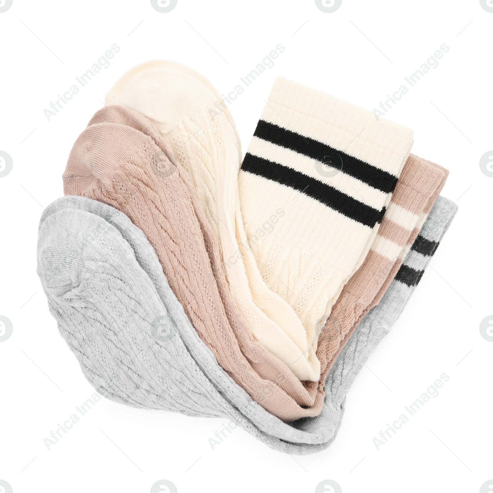 Photo of Different soft socks isolated on white, top view