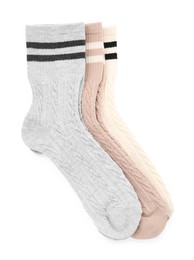 Photo of Different soft socks isolated on white, top view