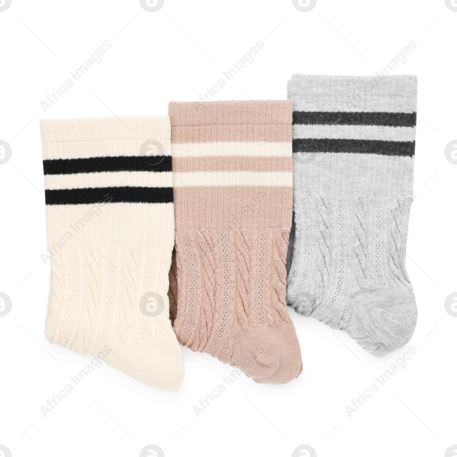 Photo of Different soft socks isolated on white, top view