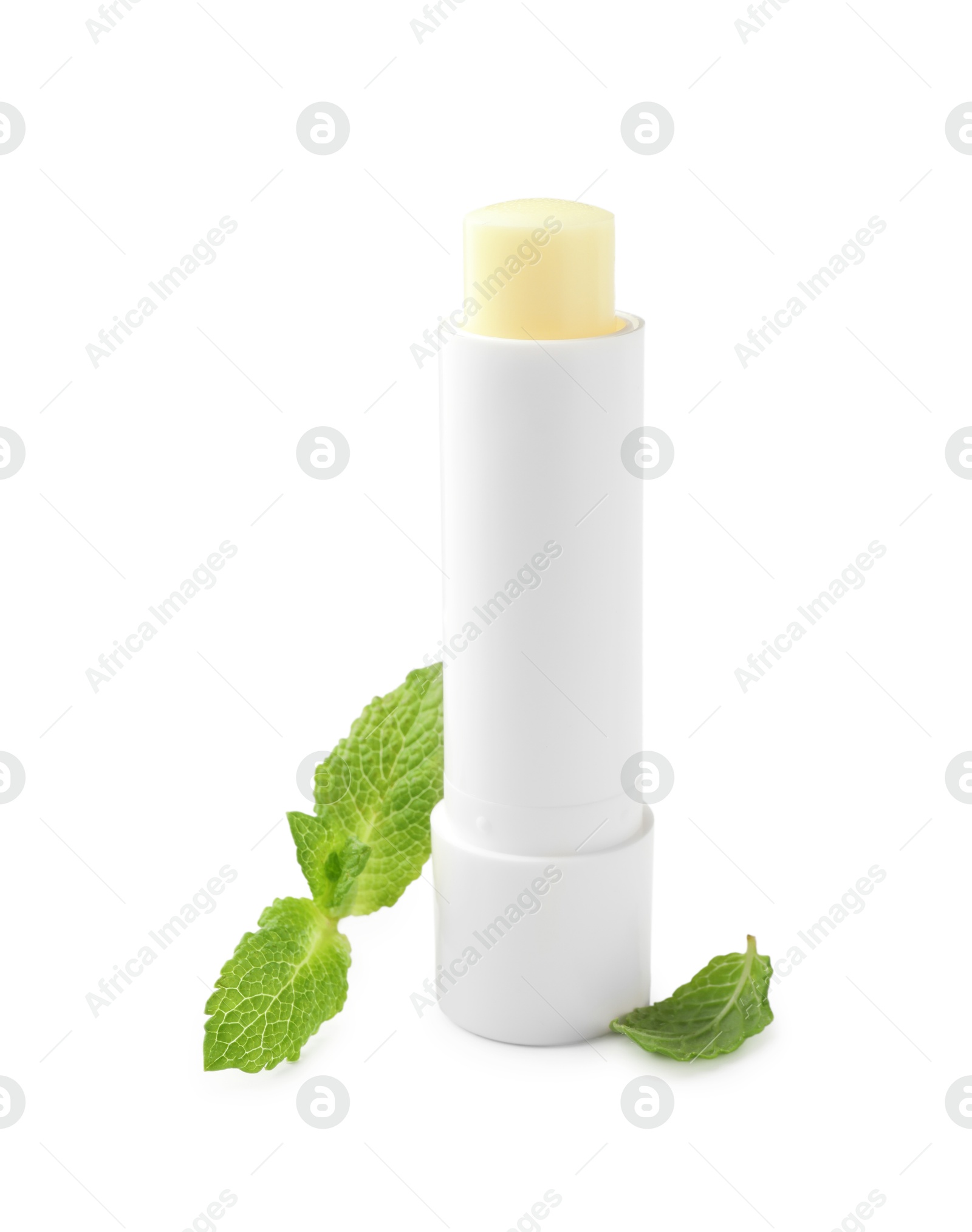 Photo of Mint lip balm and green leaves isolated on white. Cosmetic product