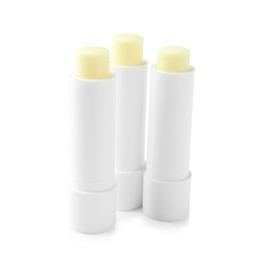 Photo of Lip balms isolated on white. Cosmetic product