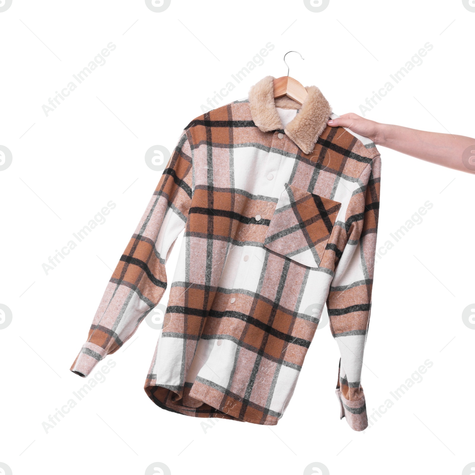 Photo of Woman holding hanger with stylish shirt on white background, closeup