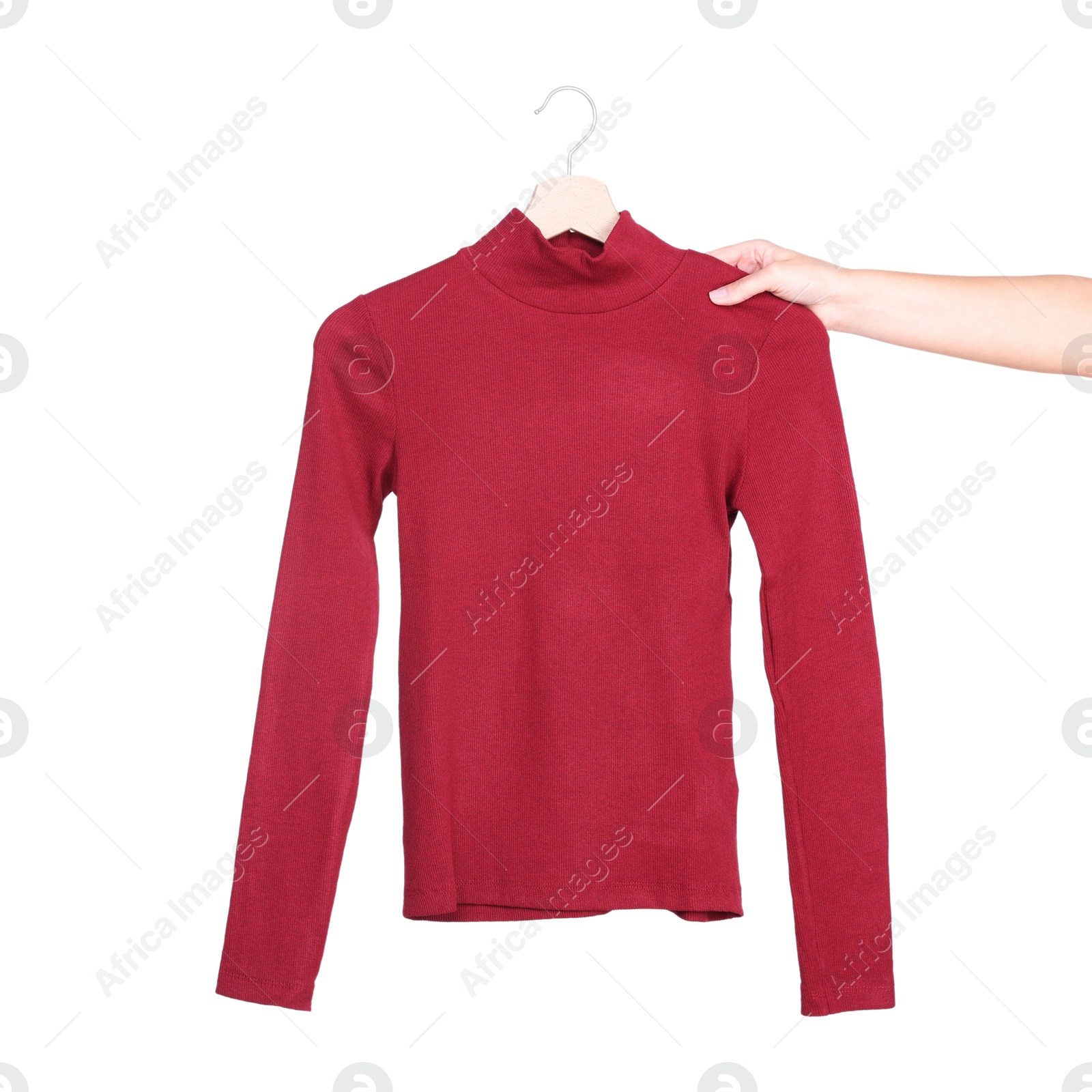 Photo of Woman holding hanger with red sweater on white background, closeup