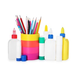 Photo of Different types of glue and pencils isolated on white