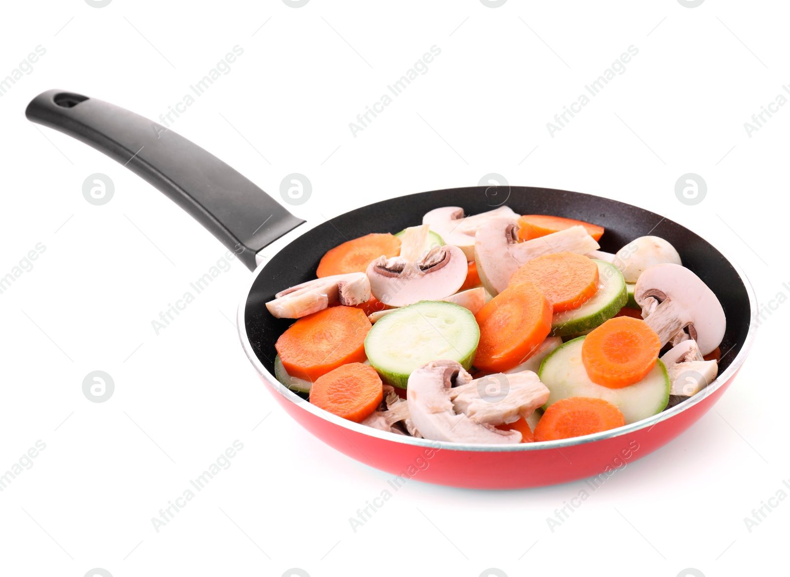 Photo of Frying pan with fresh vegetables and mushrooms isolated on white