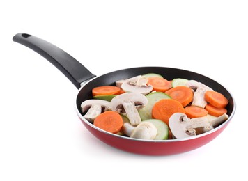 Photo of Frying pan with fresh vegetables and mushrooms isolated on white