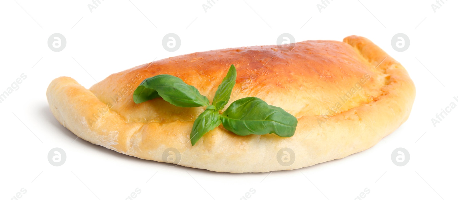 Photo of Tasty vegetarian calzone with basil isolated on white