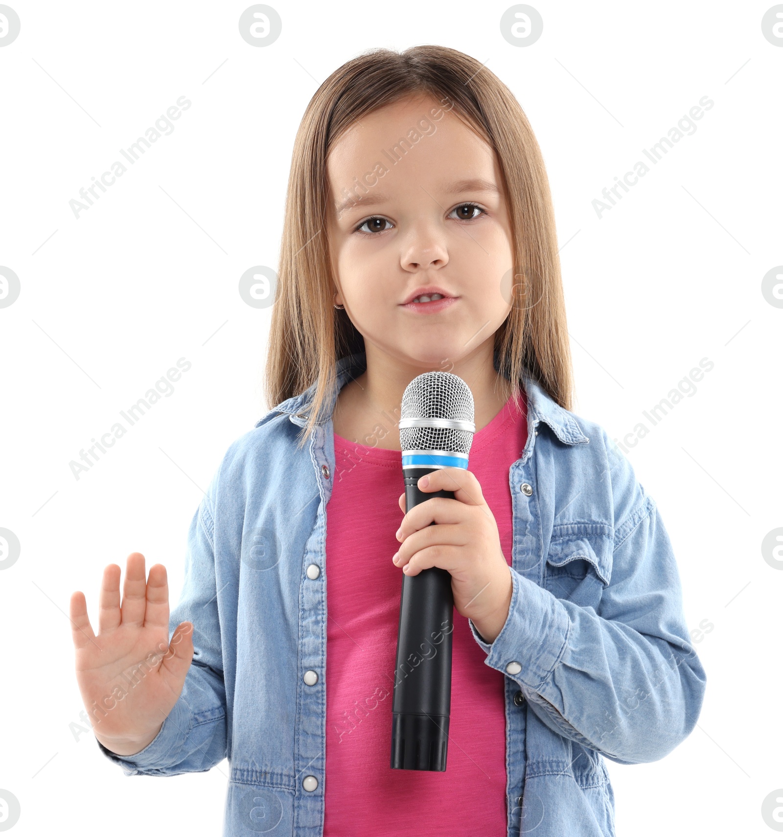 Photo of Cute girl with microphone singing on white background