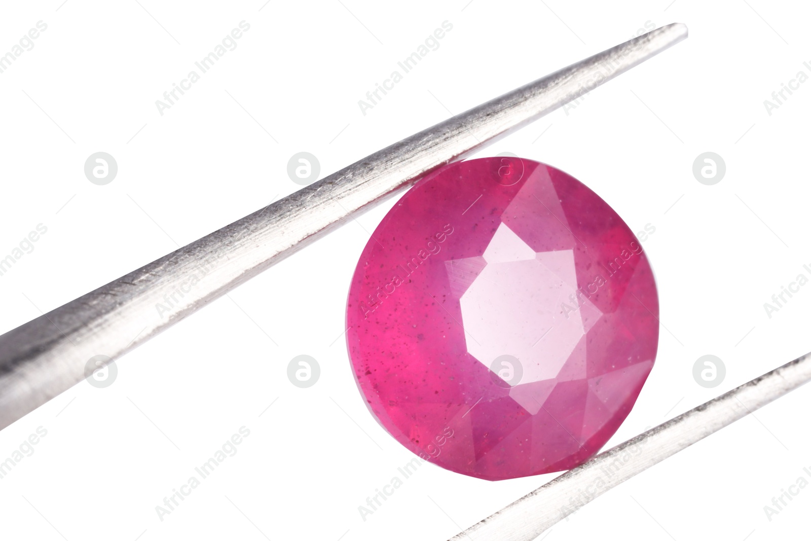 Photo of Tweezers with shiny pink gemstone isolated on white