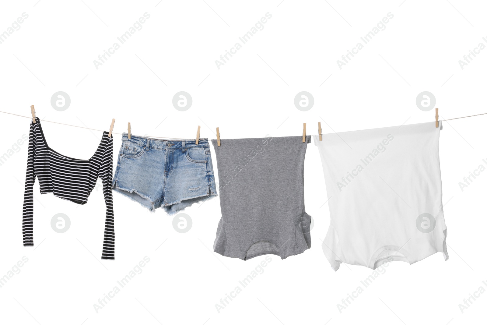 Photo of Different clothes drying on laundry line against white background