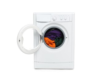 Photo of Modern washing machine with clothes in drum isolated on white