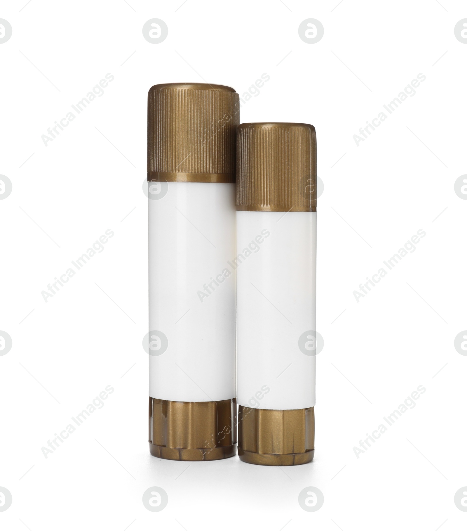 Photo of Two glue sticks with caps isolated on white