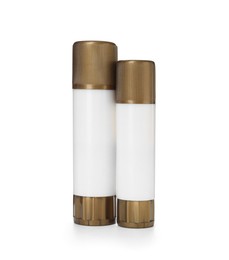 Photo of Two glue sticks with caps isolated on white