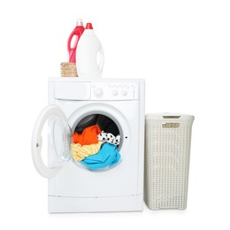 Photo of Washing machine with colorful clothes, detergents and laundry basket isolated on white