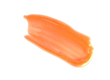 Photo of Sample of orange lipgloss isolated on white, top view