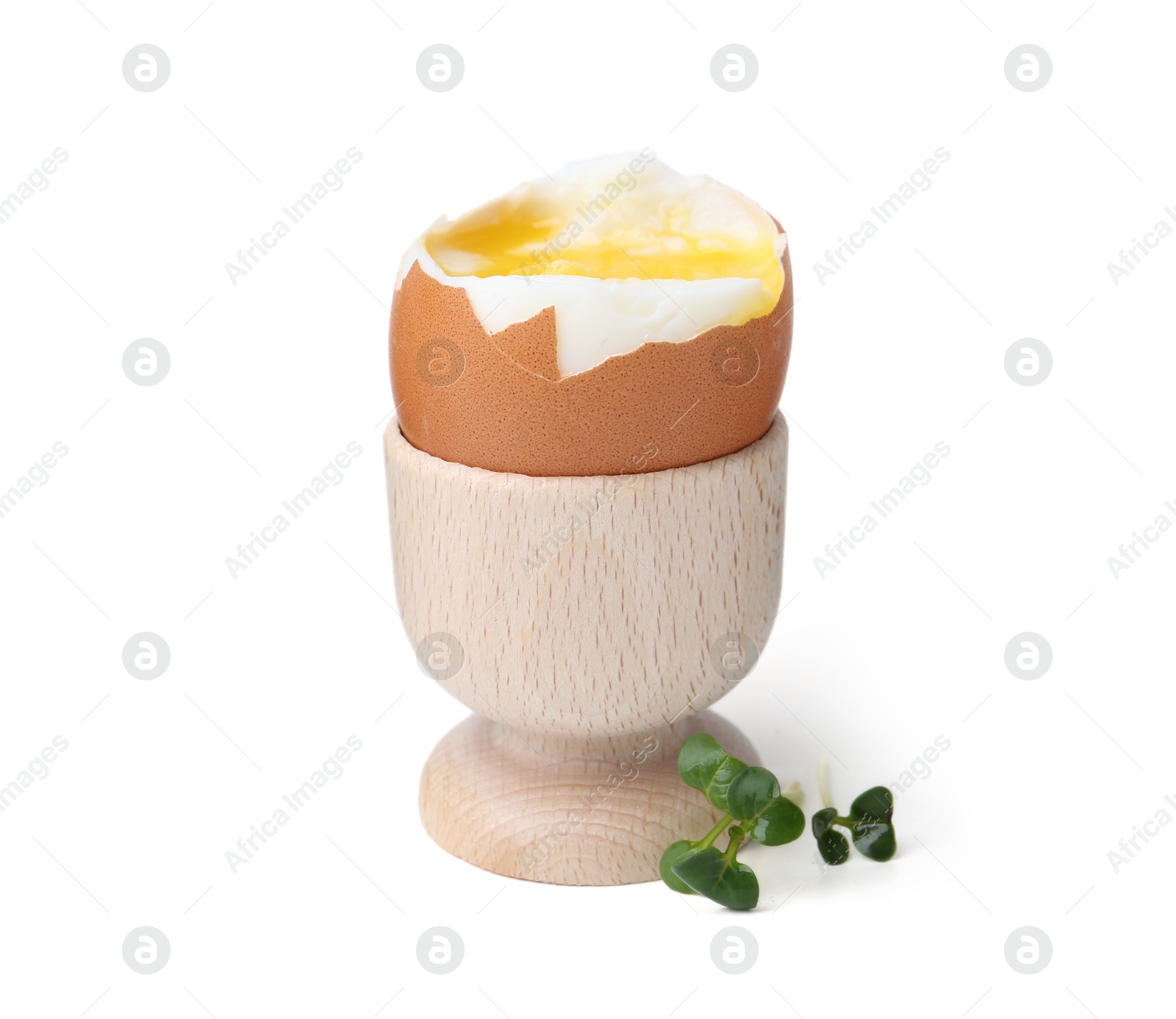 Photo of Soft boiled egg in eggcup isolated on white