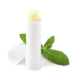 Photo of Mint lip balm and green leaves isolated on white. Cosmetic product