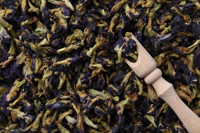 Photo of Butterfly pea flower tea with scoop as background, closeup