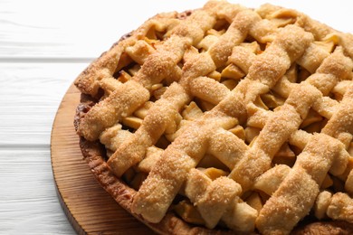 Photo of Tasty homemade apple pie on white wooden table, closeup