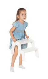 Photo of Little girl with step stool on white background