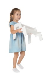 Photo of Little girl with step stool on white background