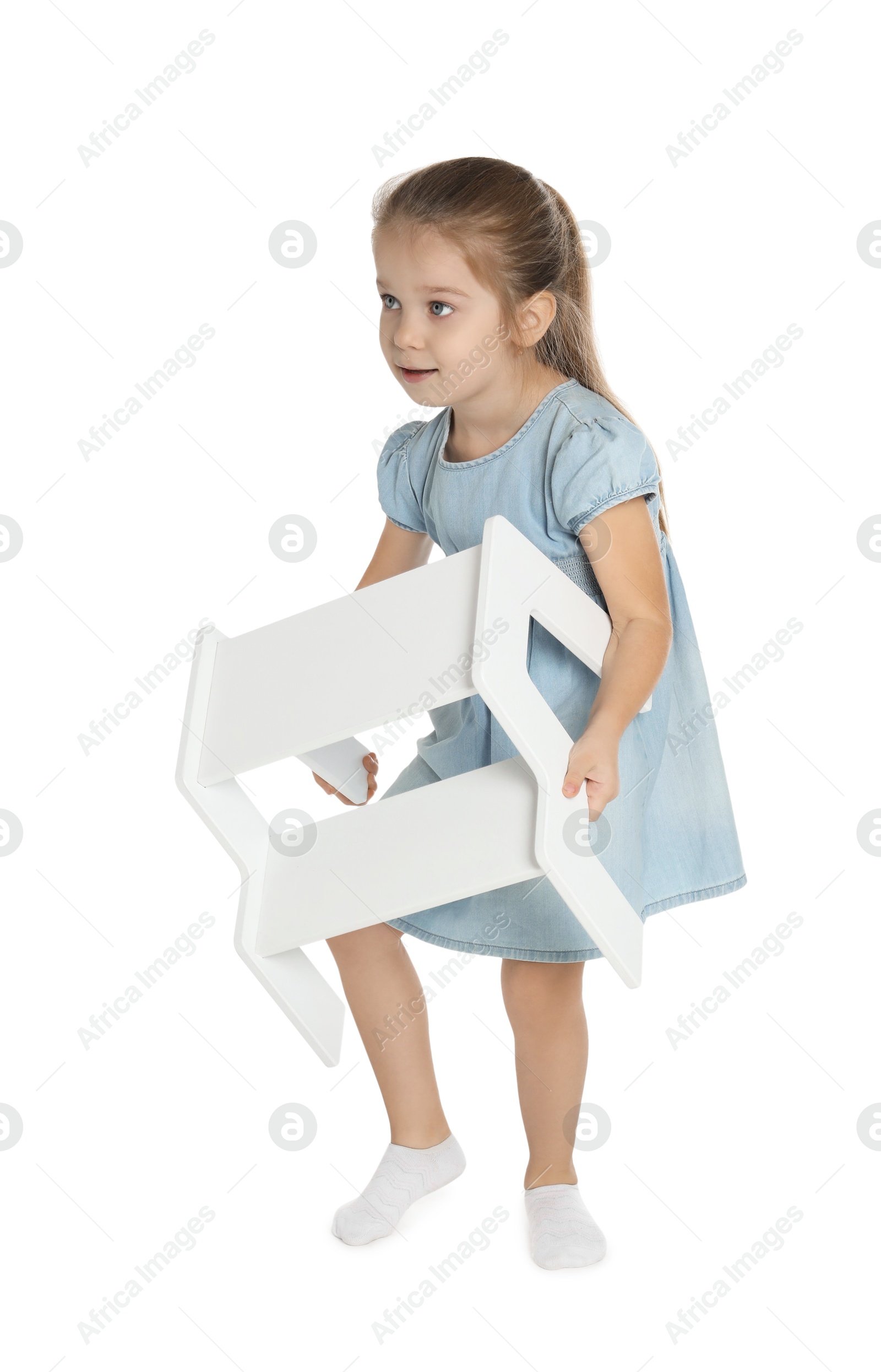 Photo of Little girl with step stool on white background