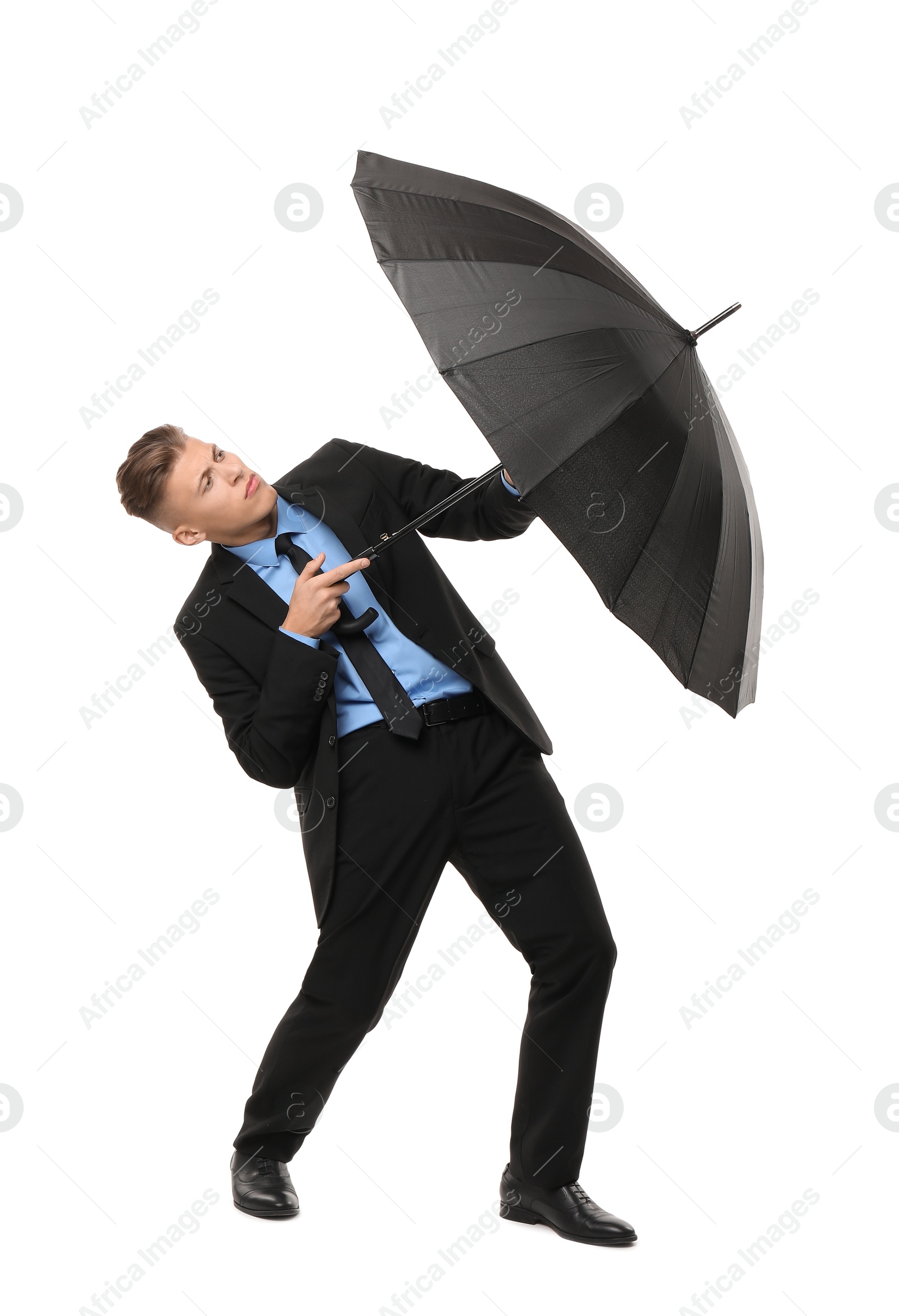 Photo of Man in suit with black umbrella on white background