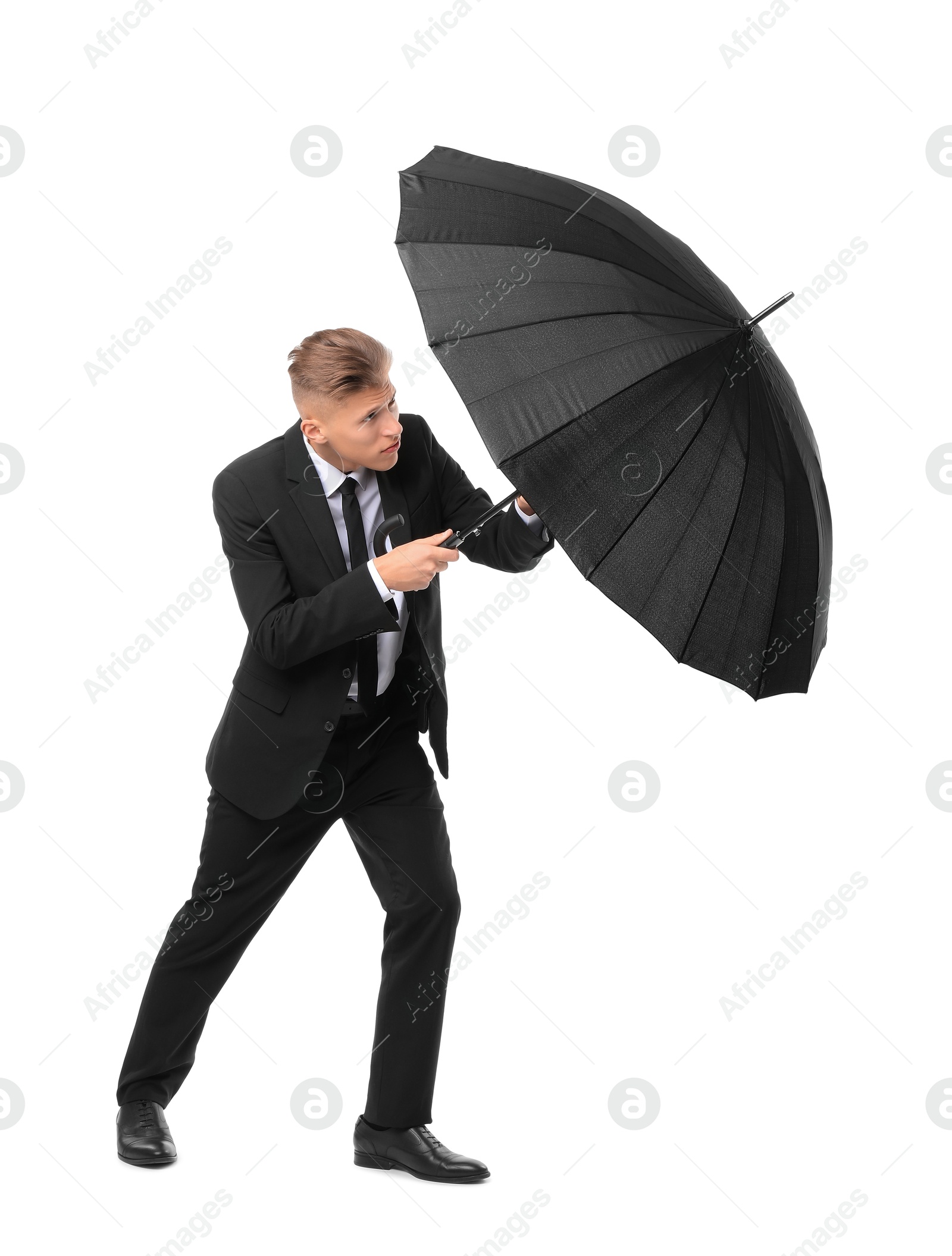 Photo of Man in suit with black umbrella on white background