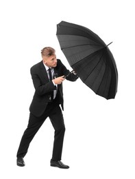 Photo of Man in suit with black umbrella on white background