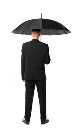 Man in suit with black umbrella on white background, back view