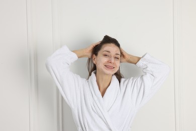 Photo of Spa day. Beautiful woman with face mask indoors