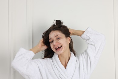 Spa day. Beautiful woman with face mask indoors