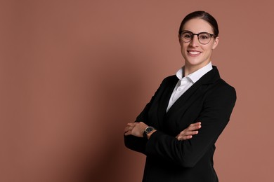 Photo of Portrait of banker in glasses on brown background, space for text