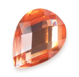 Photo of One orange shiny gemstone isolated on white