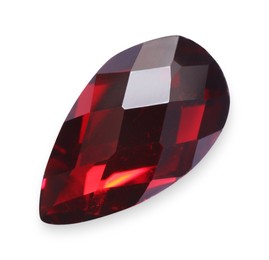 Photo of One red shiny gemstone isolated on white