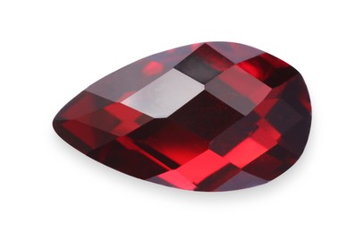 Photo of One red shiny gemstone isolated on white