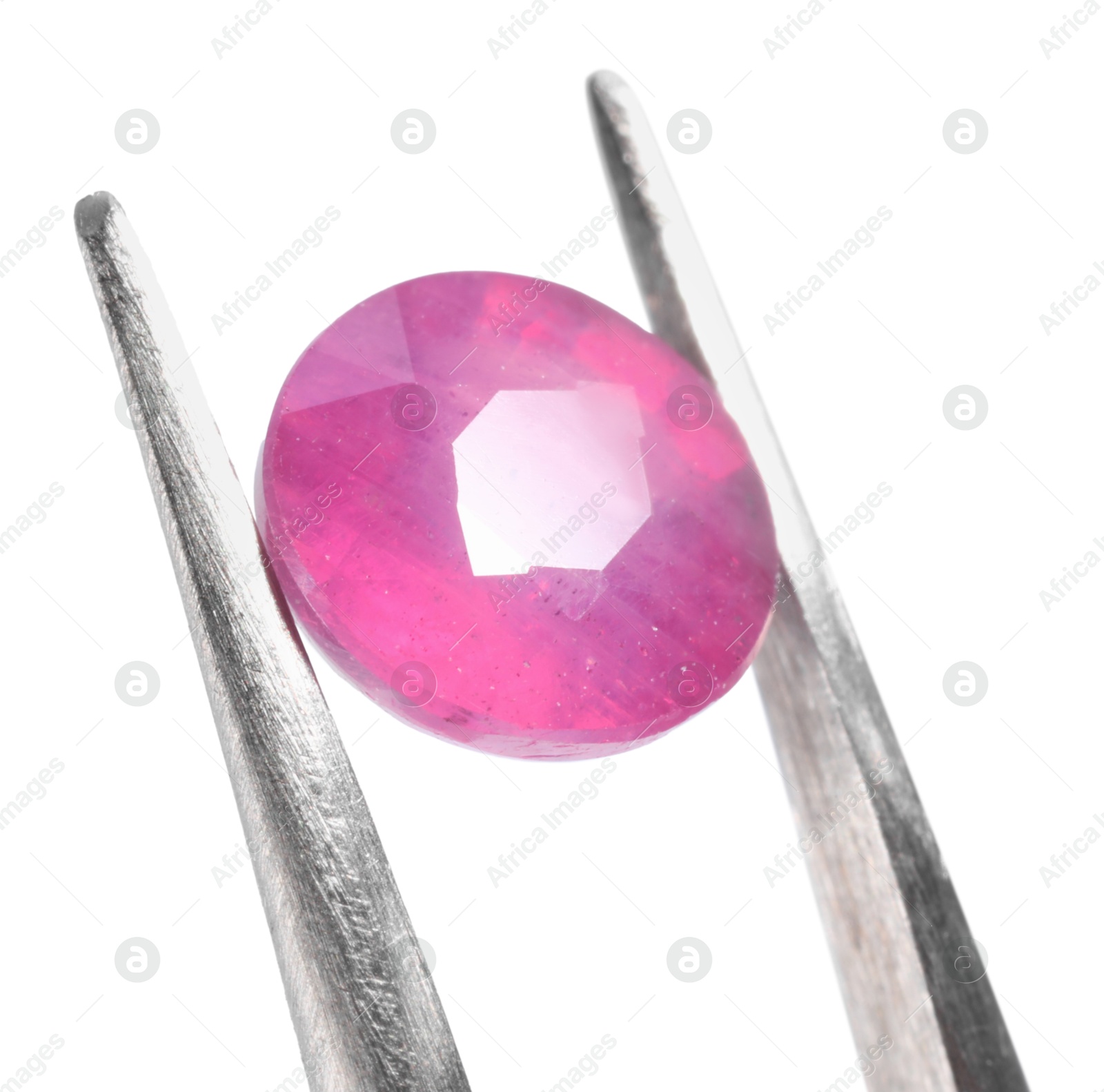 Photo of Tweezers with shiny pink gemstone isolated on white