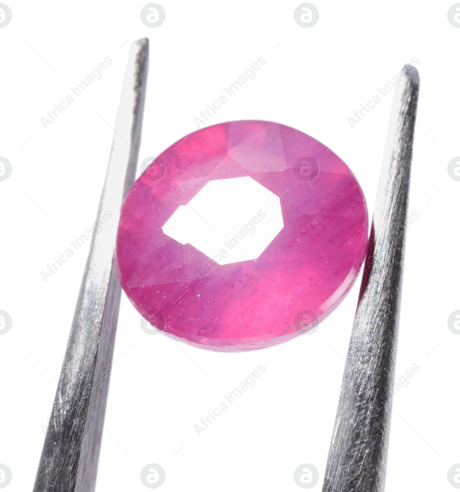 Photo of Tweezers with shiny pink gemstone isolated on white