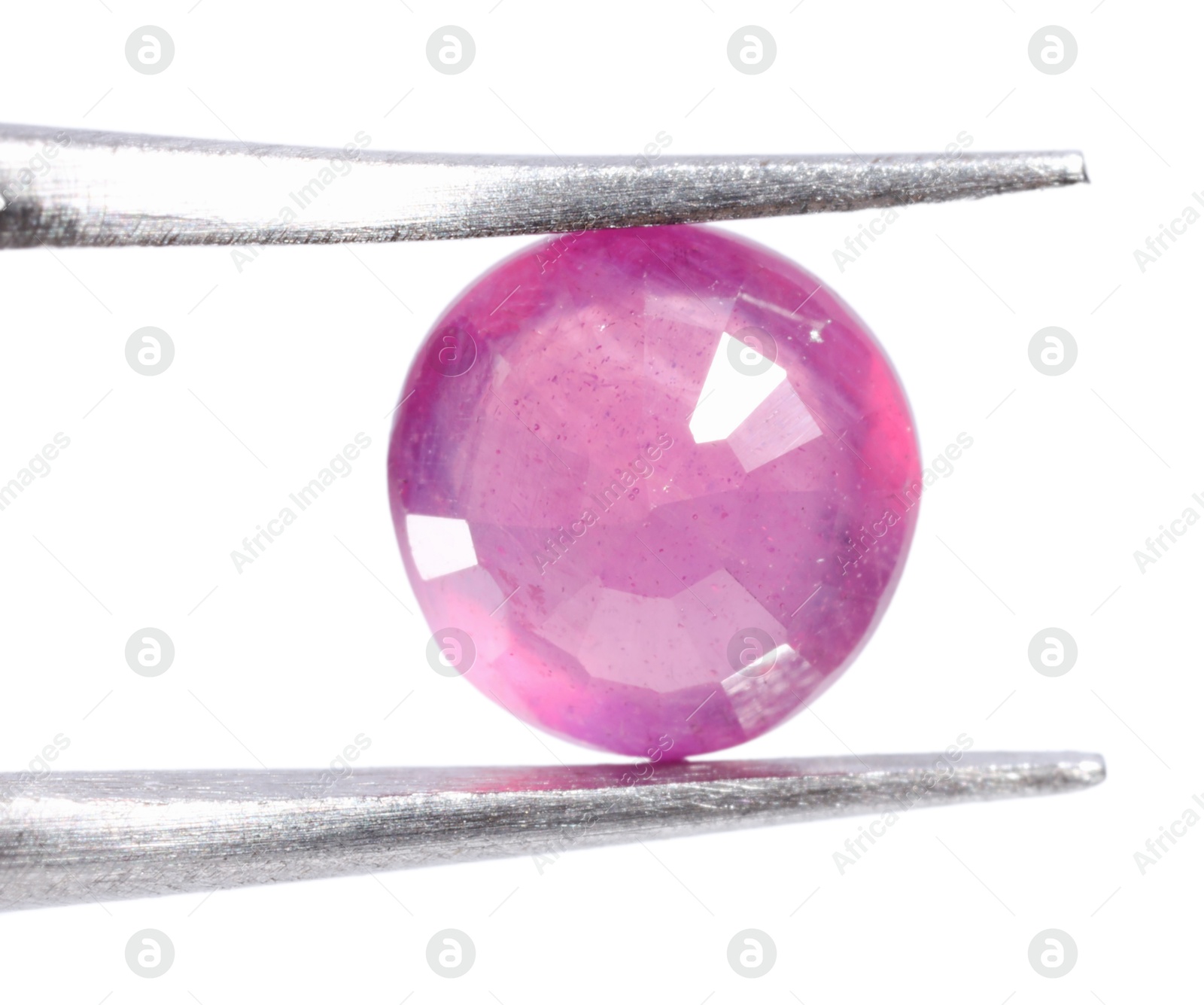 Photo of Tweezers with shiny pink gemstone isolated on white