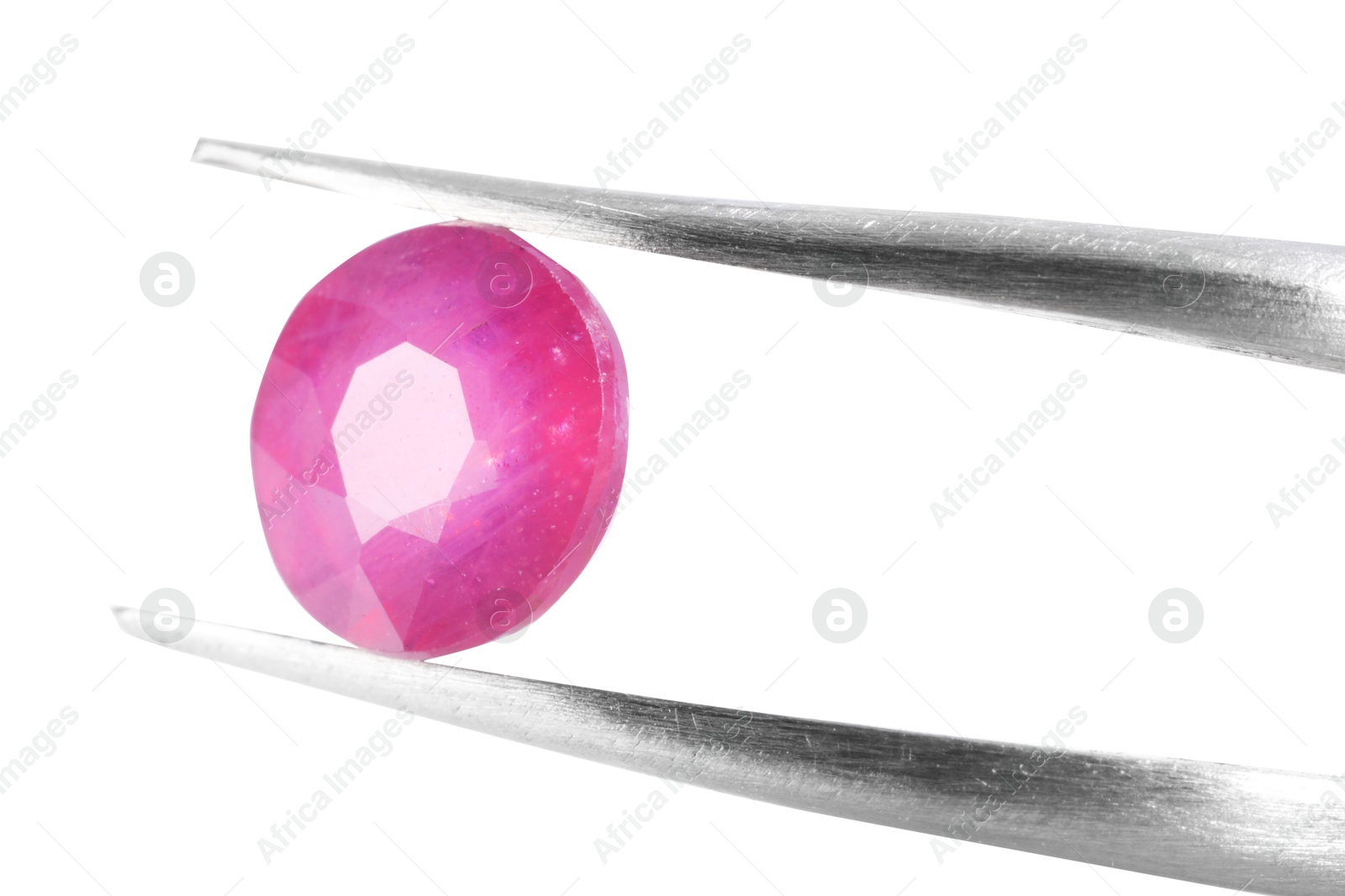 Photo of Tweezers with shiny pink gemstone isolated on white