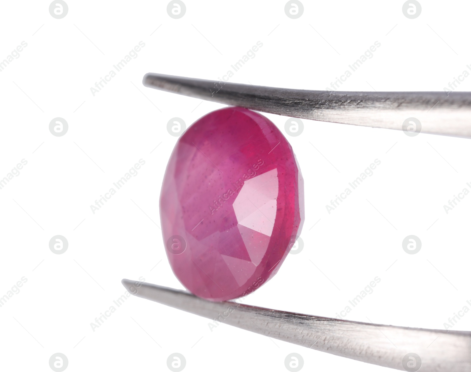 Photo of Tweezers with shiny pink gemstone isolated on white