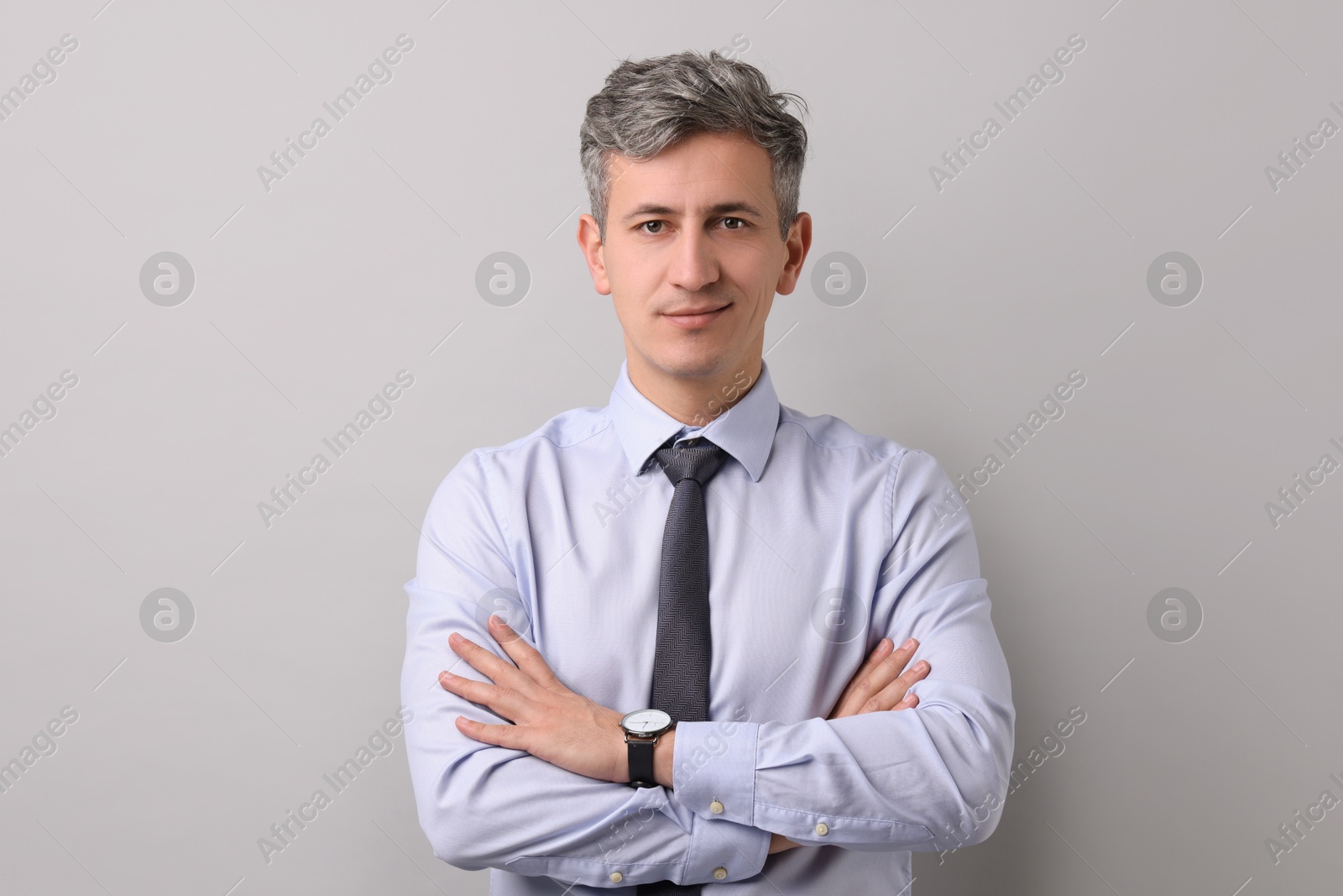 Photo of Portrait of businessman on light grey background