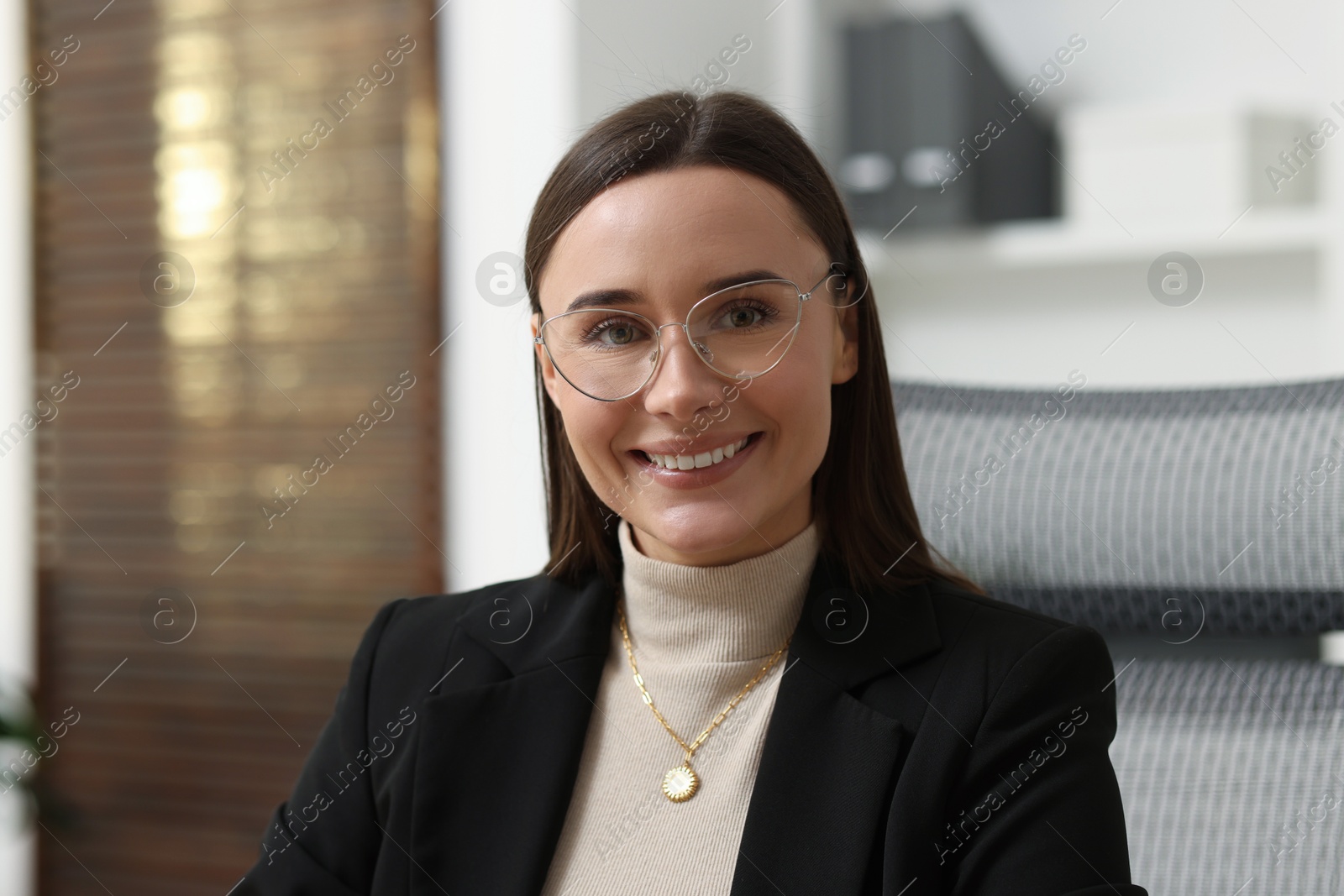 Photo of Portrait of businesswoman in glasses at workplace