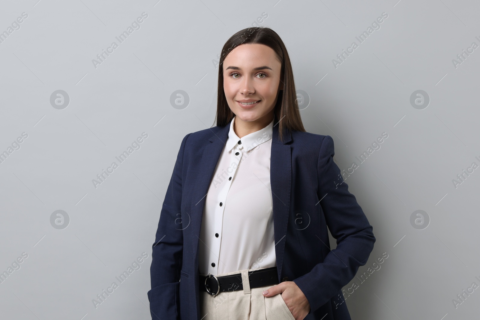 Photo of Portrait of businesswoman on light grey background